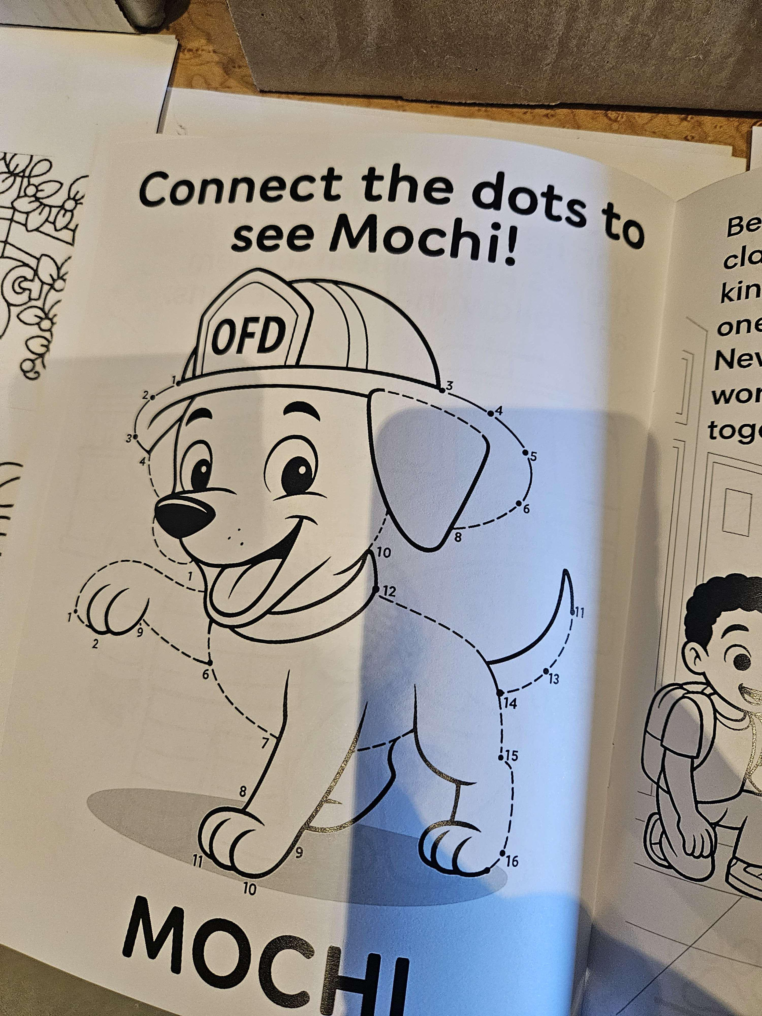 Photo of a book containing a connect the dots image. You can tell it was AI generated because all of it is pre-traced so you can clearly see the dog, and the numbering makes no sense at all.