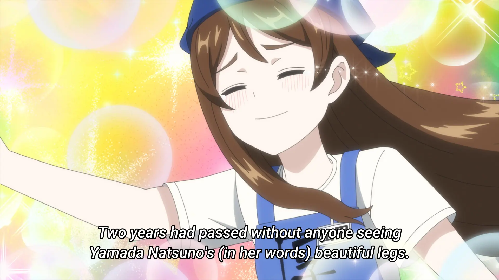 Screenshot from the anime "Ballpark de Tsukamaete!" showing a girl with a forced happy expression masking the mental pain underneath. The subtitle says: "Two years had passed without anyone seeing Yamada Natsuno's (in her words) beauitful legs."