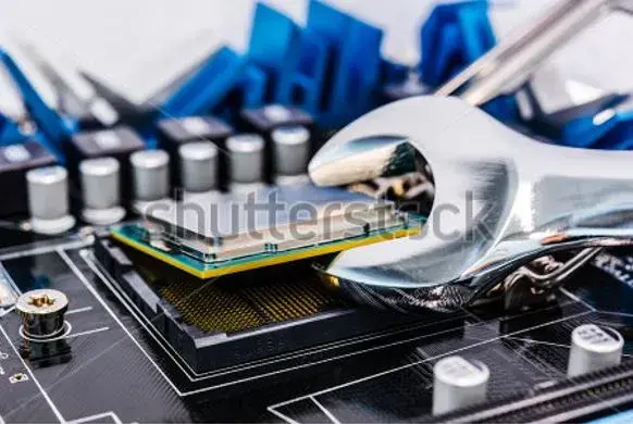 Stock image of a CPU being lifted from its socket with a wrench.