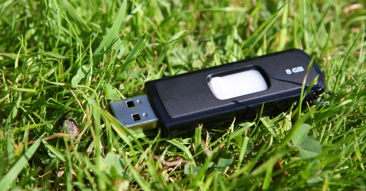 A USB drive lying on the ground.
