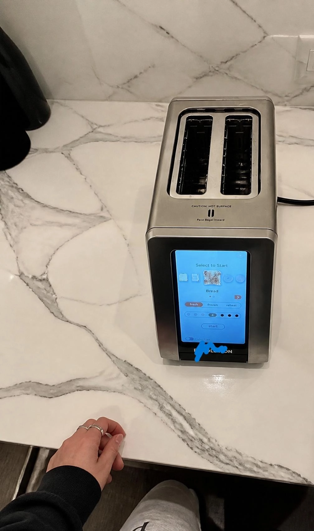 A toaster with a large touch screen on its short side. You can select the type of bread, whether it's fresh or frozen and the duration. It allegedly also shows a weather report, meaning it's connected to the internet.