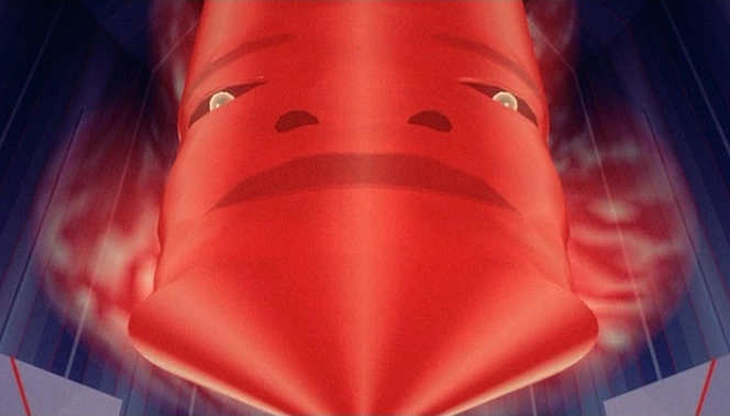 The Master Control Program from the movie "Tron" from 1982. It looks like a red cylinder with a stretched face which looks like the cat's face in the post I replied to.